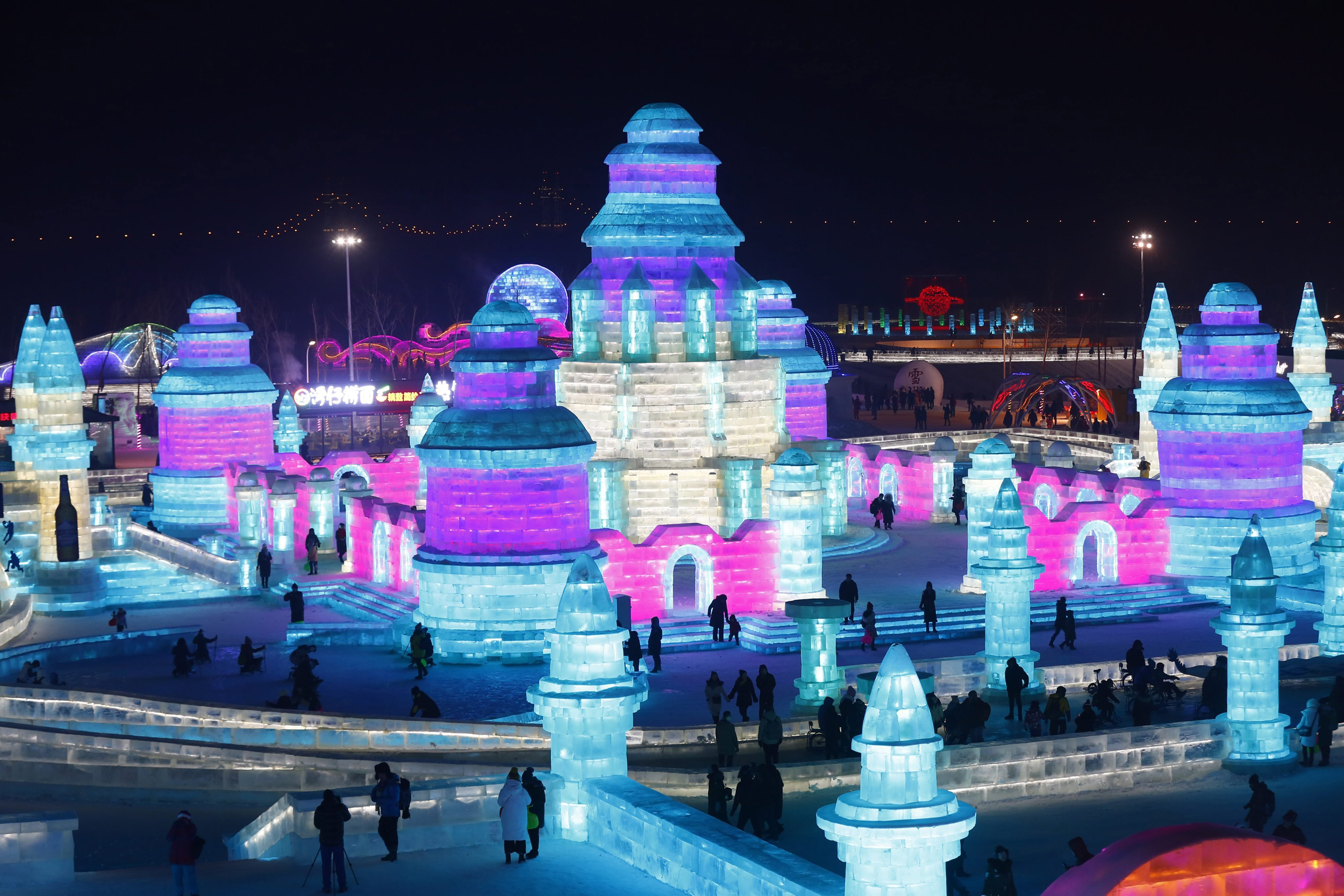 Captivating ice sculpture at a competition, beautifully illuminated and attracting spectators